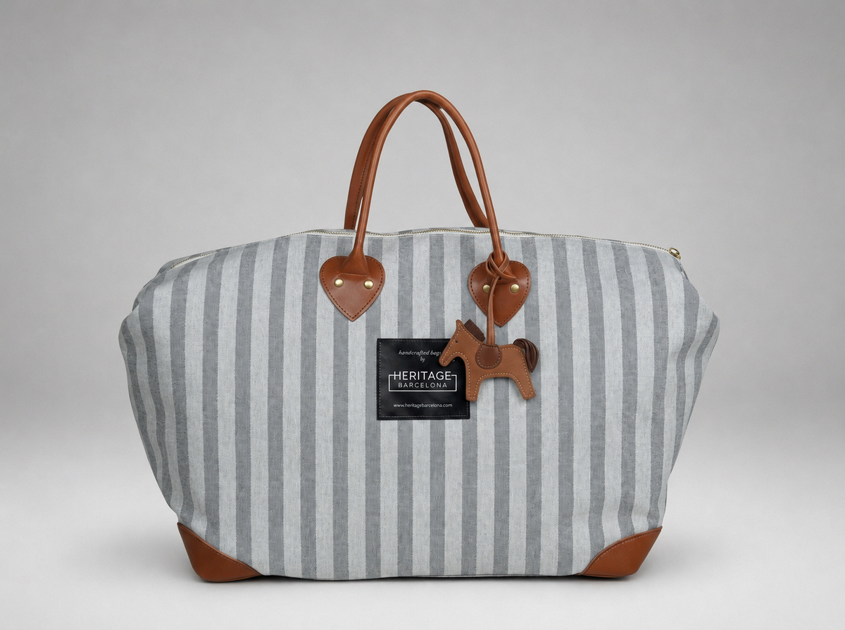 Handmade Weekend Bag in Natural Canvas · Leather handles and horse charm